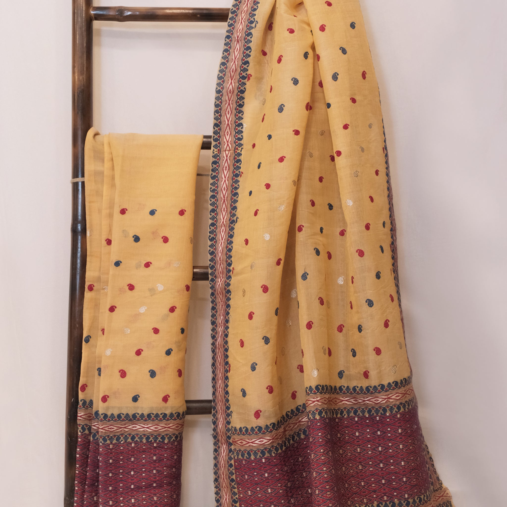 Mekhela Sador - Mulberry silk (nuni silk) motifs in Eri silk natural dye